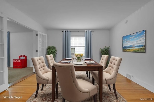 dining space featuring hardwood / wood-style flooring