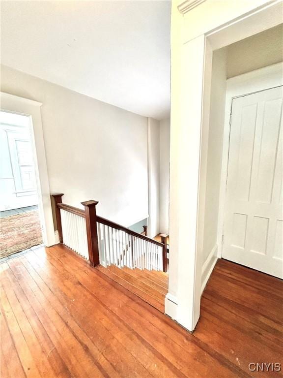 stairs featuring hardwood / wood-style flooring