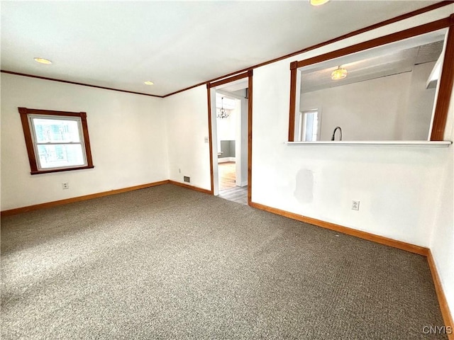 carpeted empty room with ornamental molding