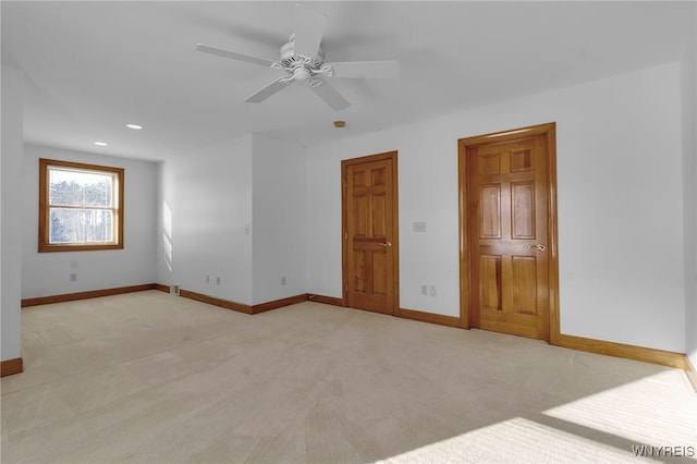 carpeted empty room with ceiling fan