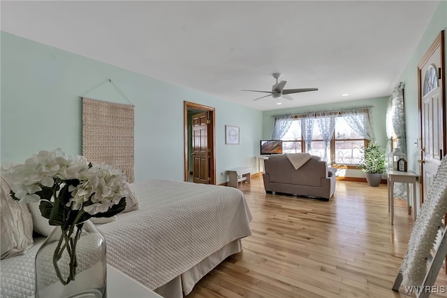 bedroom featuring ceiling fan and light hardwood / wood-style floors