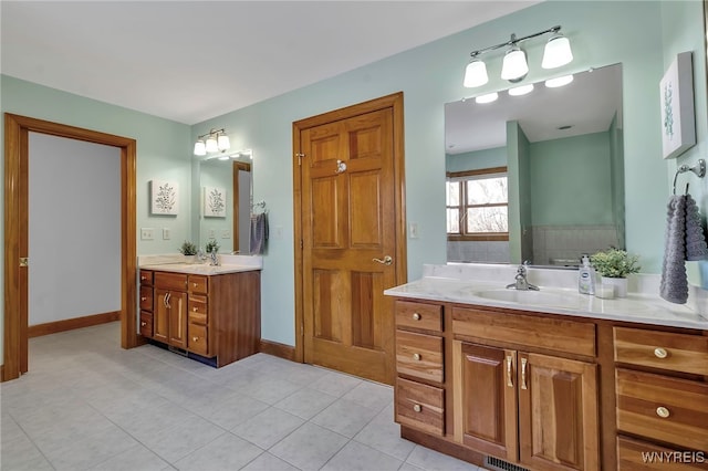 bathroom featuring tile patterned flooring and vanity