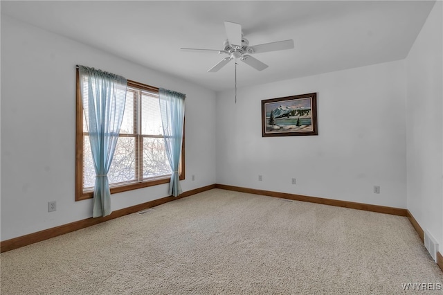 spare room with ceiling fan and carpet flooring