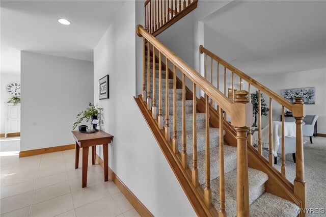 staircase with tile patterned floors