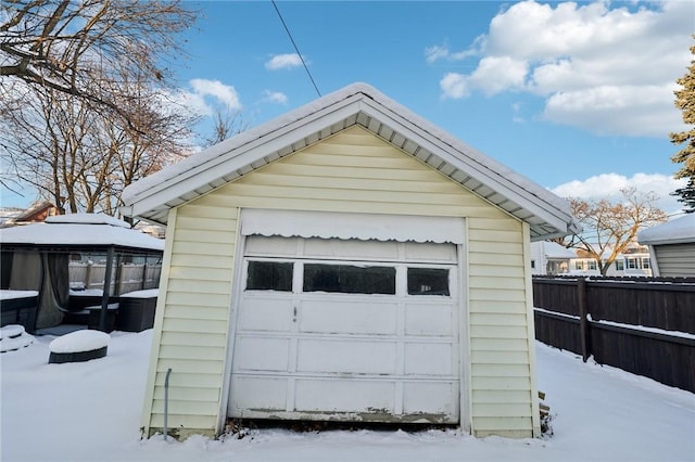 view of snow covered garage