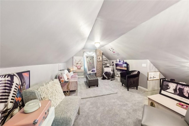 interior space featuring light colored carpet and vaulted ceiling