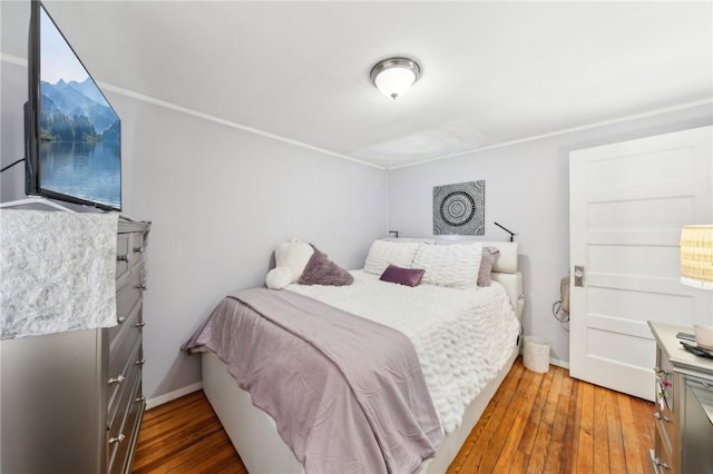 bedroom featuring wood-type flooring