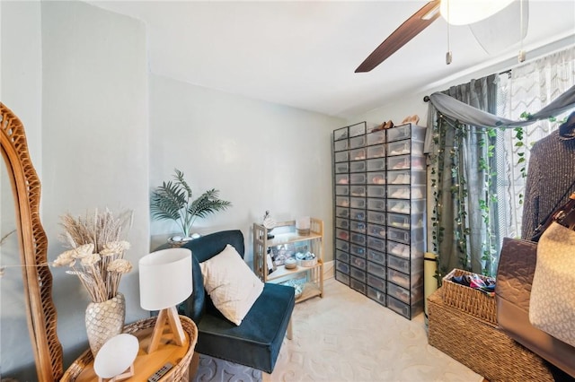 sitting room with ceiling fan