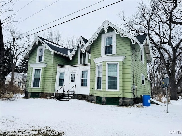 view of snow covered house