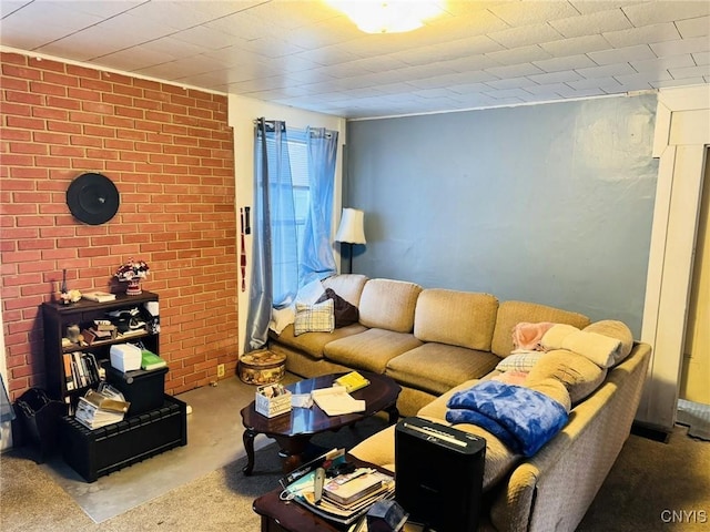 carpeted living room featuring brick wall