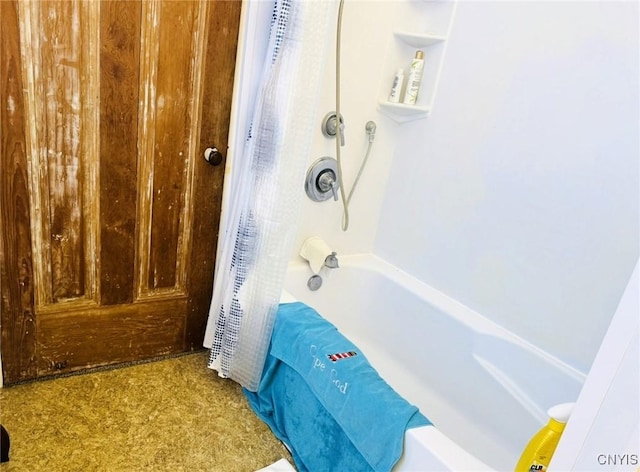 bathroom featuring shower / bathtub combination with curtain