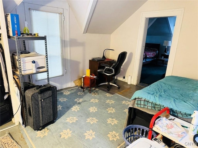 bedroom featuring lofted ceiling