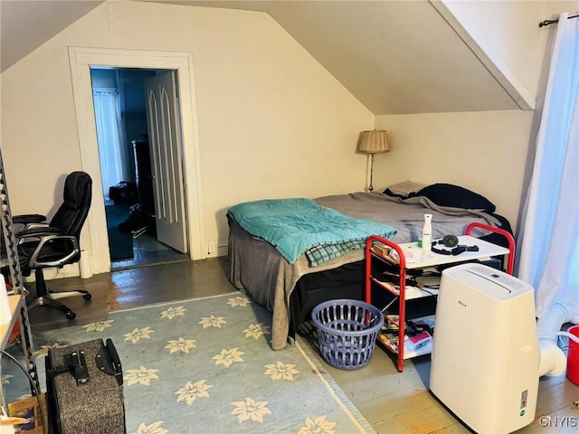 bedroom with lofted ceiling