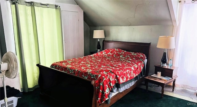 carpeted bedroom featuring lofted ceiling