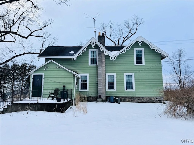 view of snow covered house