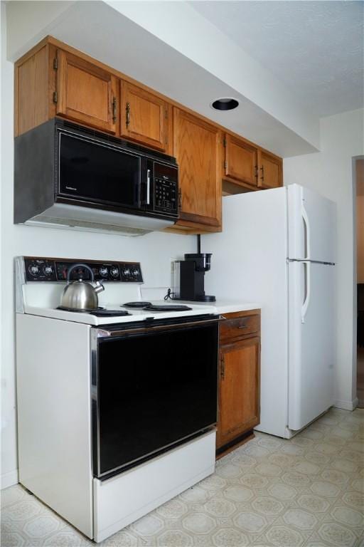 kitchen featuring white appliances