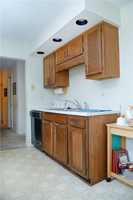 kitchen featuring black dishwasher and sink