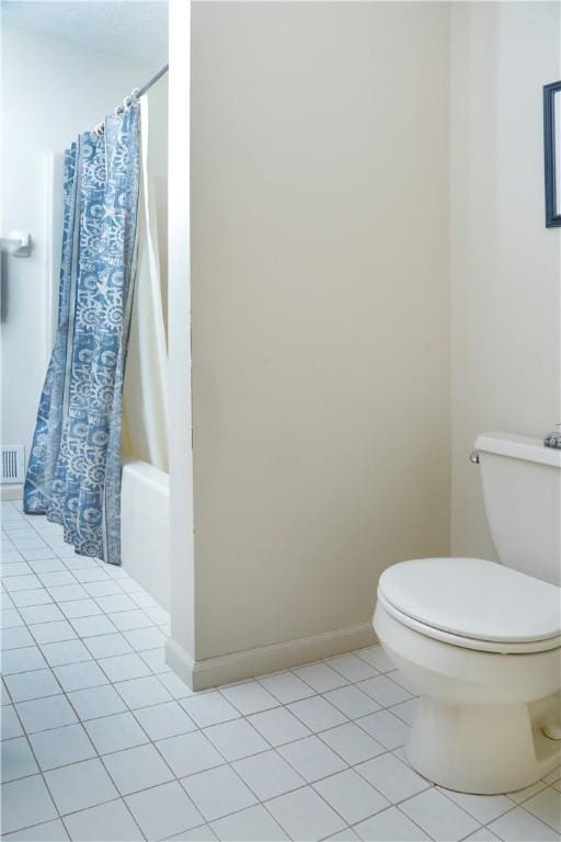 bathroom with toilet, tile patterned flooring, and shower / bath combination with curtain