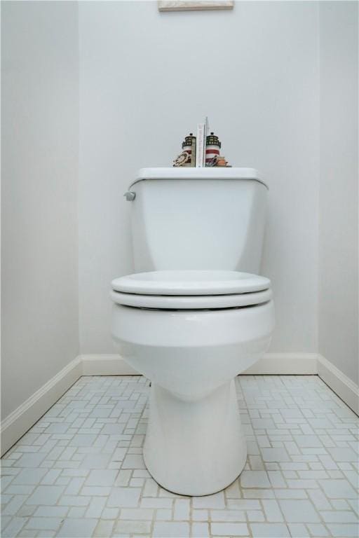 bathroom featuring tile patterned floors and toilet