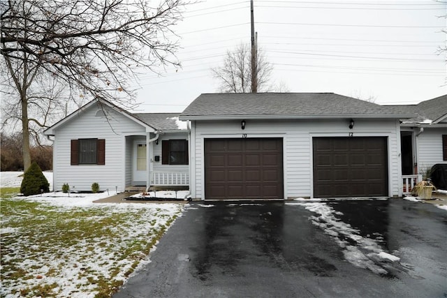 ranch-style home featuring a garage