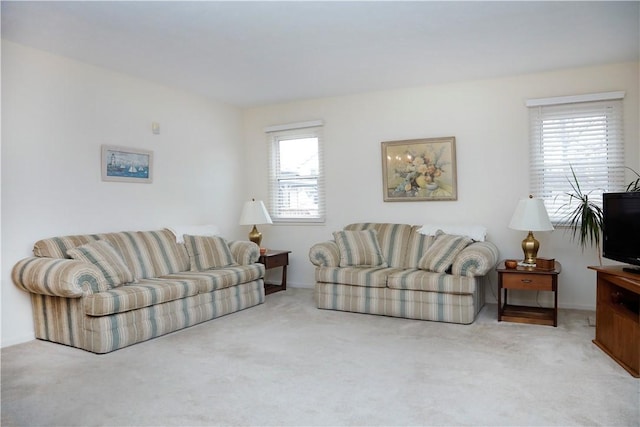 living room featuring light carpet