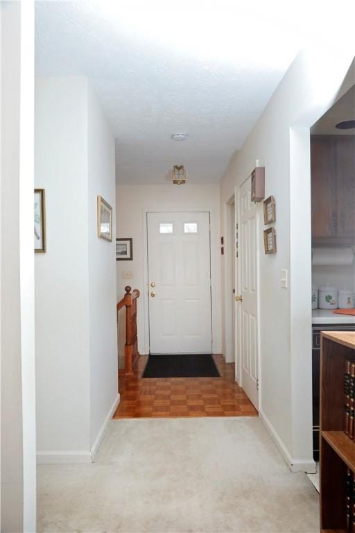 entryway featuring light colored carpet