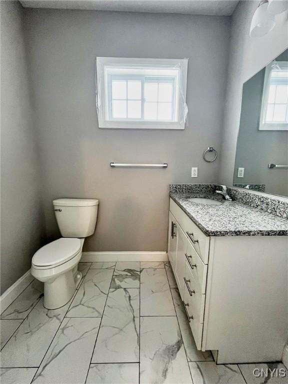 bathroom with toilet and vanity