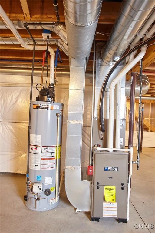 utility room with gas water heater