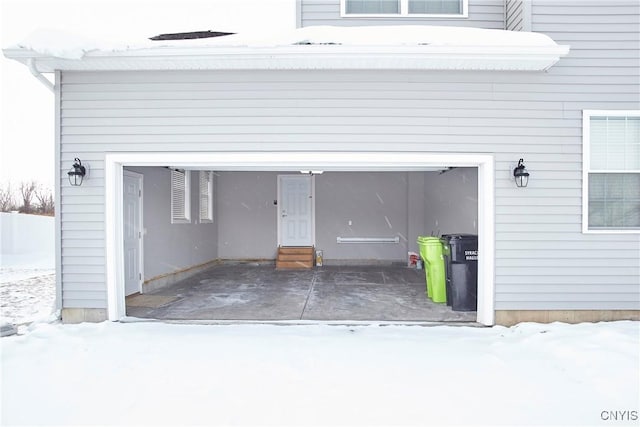 view of snow covered garage