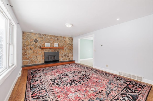 living room featuring a fireplace and hardwood / wood-style floors