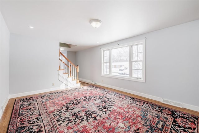 unfurnished room featuring hardwood / wood-style flooring