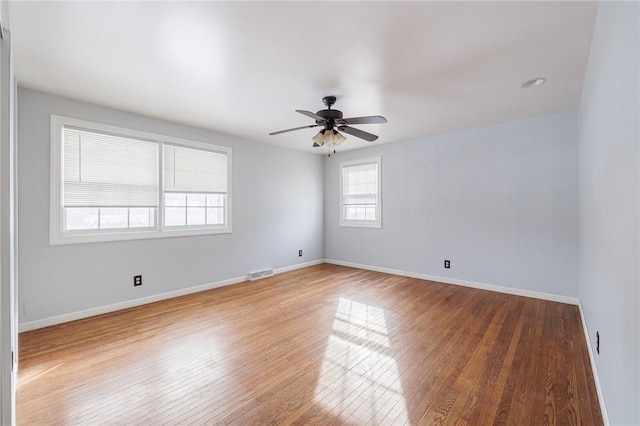 spare room featuring ceiling fan and wood-type flooring