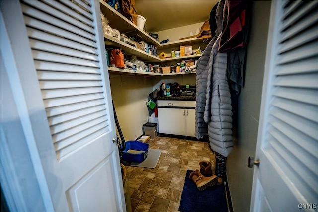 laundry area with stone finish flooring