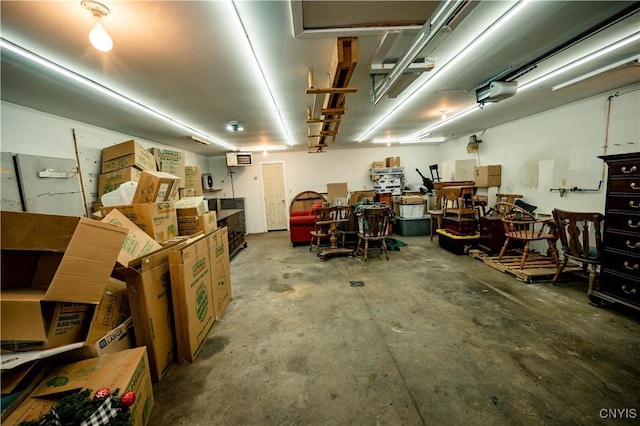 garage featuring a wall unit AC and a garage door opener