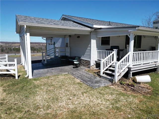 view of home's exterior featuring roof with shingles and a lawn