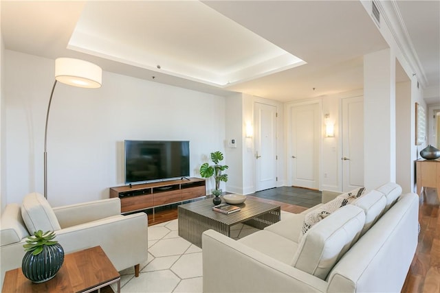 living room with a raised ceiling