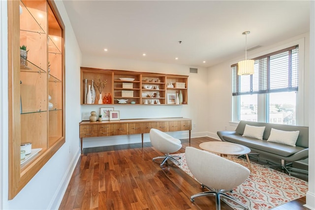 living room featuring dark wood-type flooring