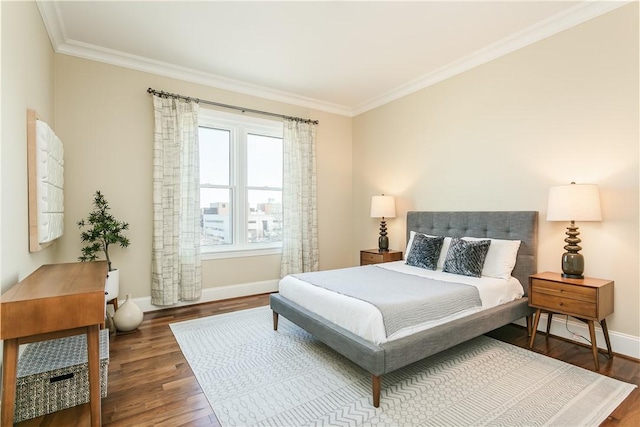 bedroom with dark hardwood / wood-style flooring and ornamental molding