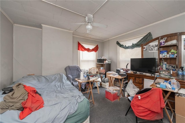 carpeted bedroom featuring ceiling fan and ornamental molding