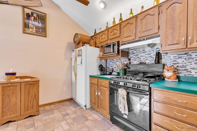 kitchen featuring ceiling fan, black gas range oven, tasteful backsplash, lofted ceiling, and white fridge with ice dispenser