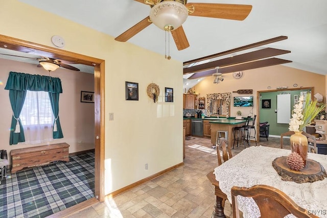 dining area featuring ceiling fan and vaulted ceiling