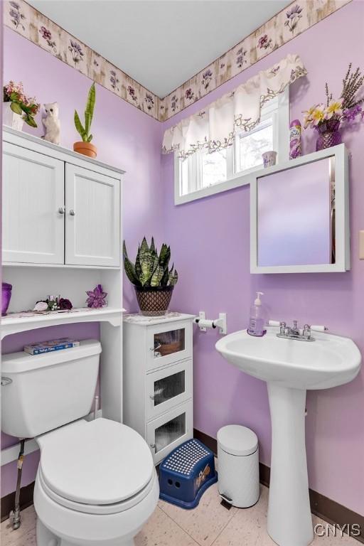 bathroom featuring tile patterned floors and toilet