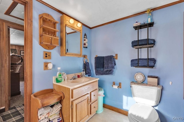 bathroom with a textured ceiling, toilet, vanity, and crown molding