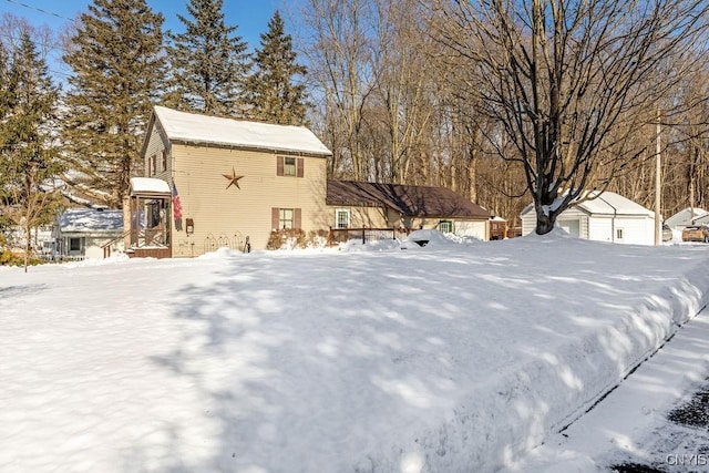 yard layered in snow with a garage