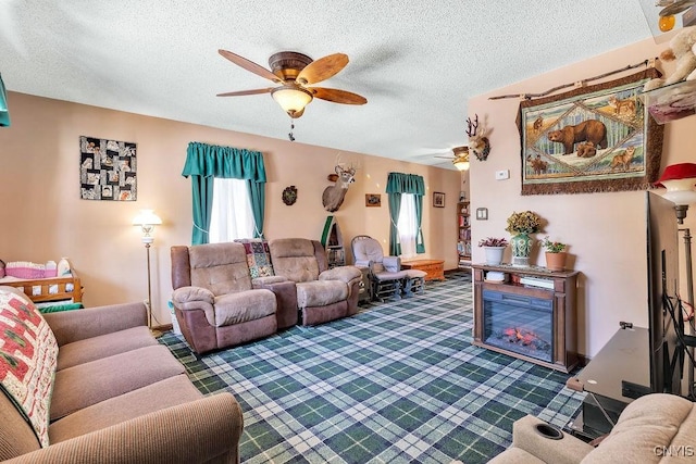 carpeted living room featuring a textured ceiling and ceiling fan