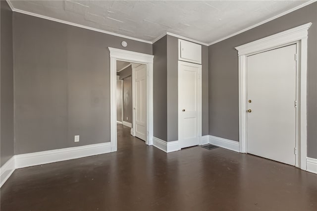 spare room featuring crown molding