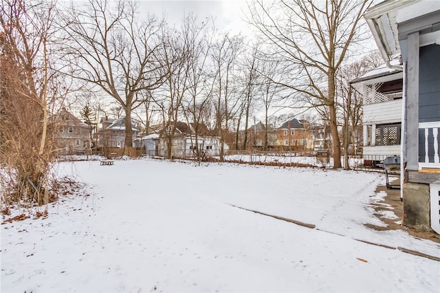 view of yard covered in snow