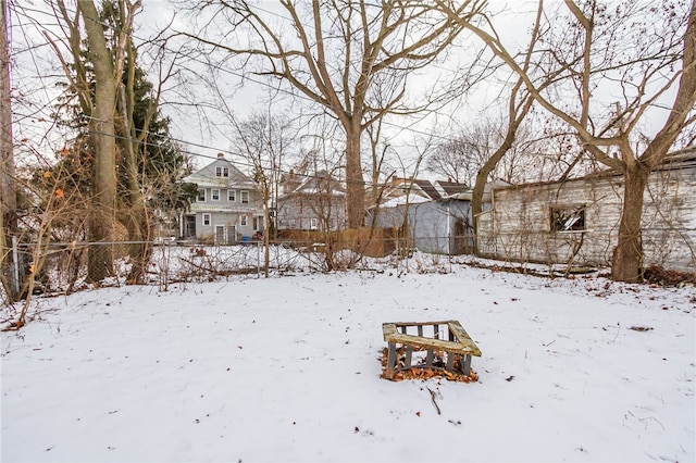 view of yard layered in snow