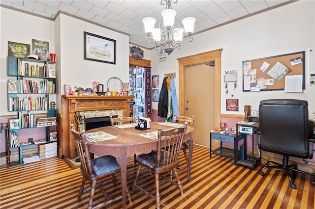 carpeted dining room featuring ornamental molding and a notable chandelier