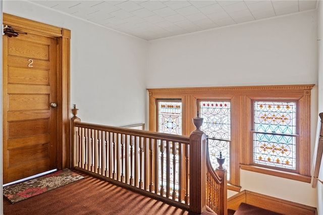 interior space with plenty of natural light and carpet